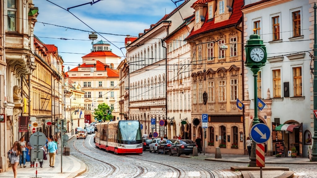 Modern Tram between Historic Buildings in Prague